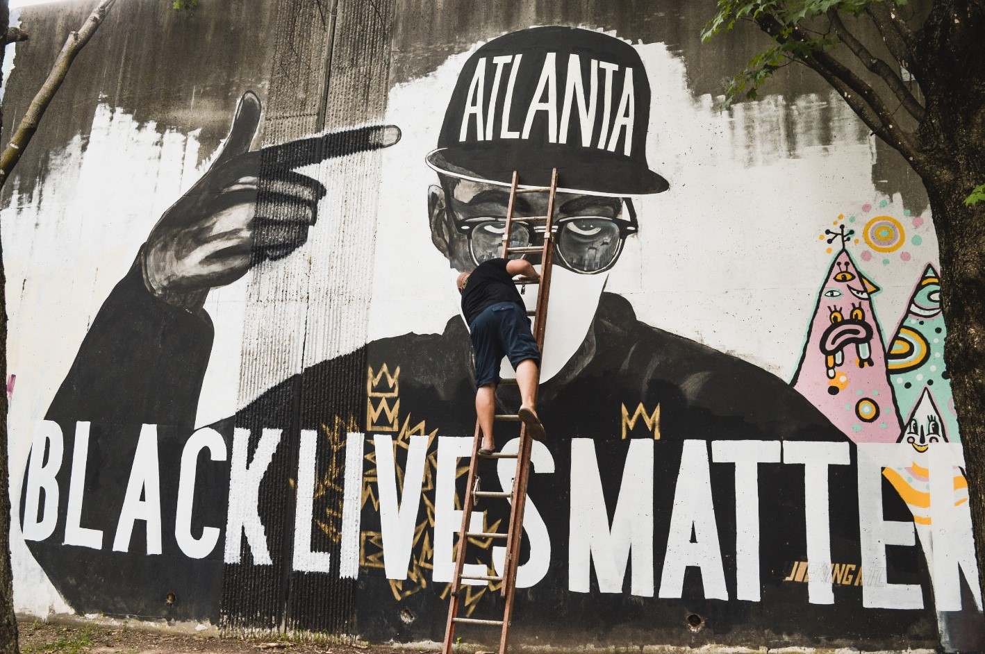 Black Artists Deface Their Own Murals to Raise Awareness to Pandemic in Their Communities